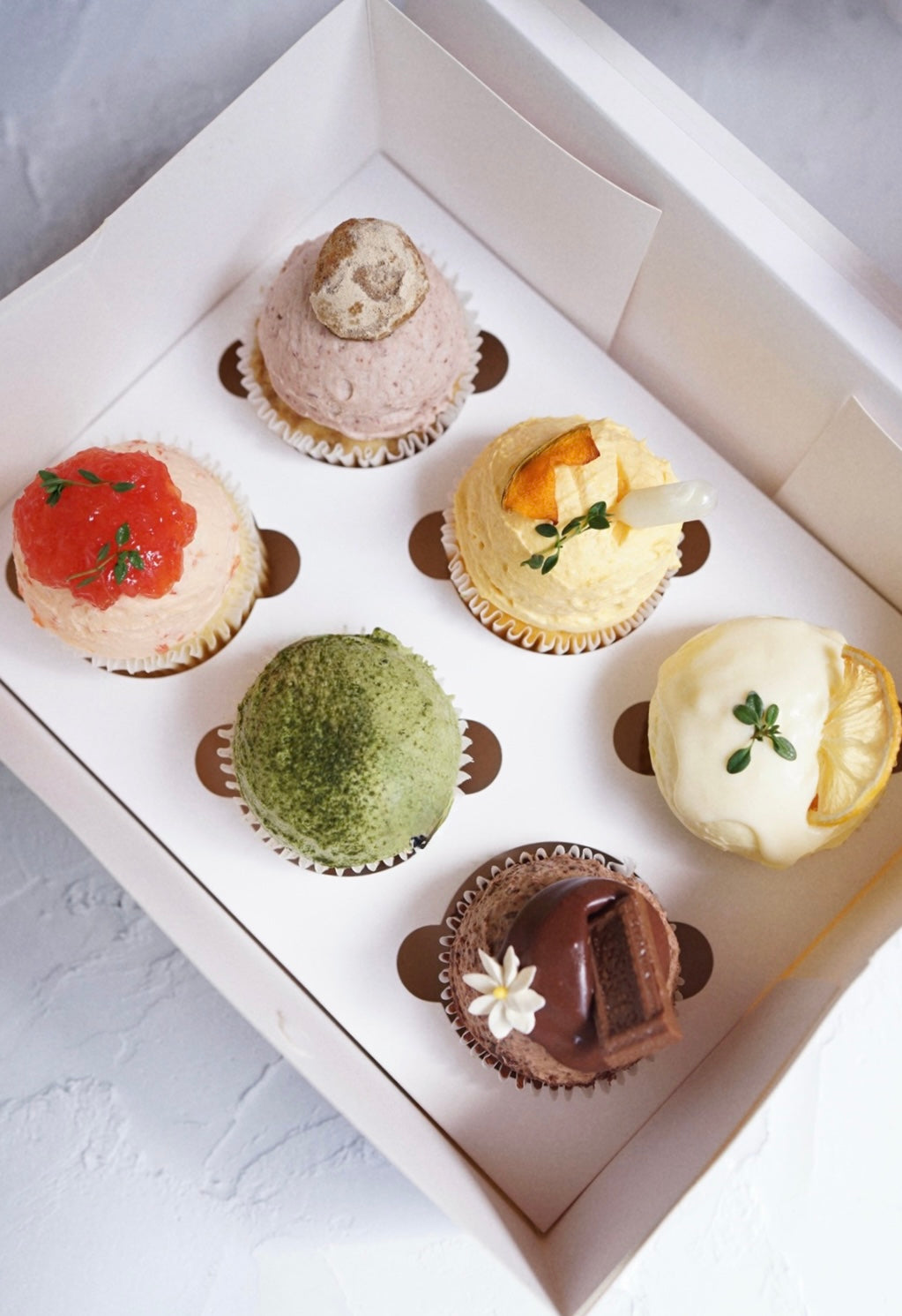 Assorted fresh cream cupcakes