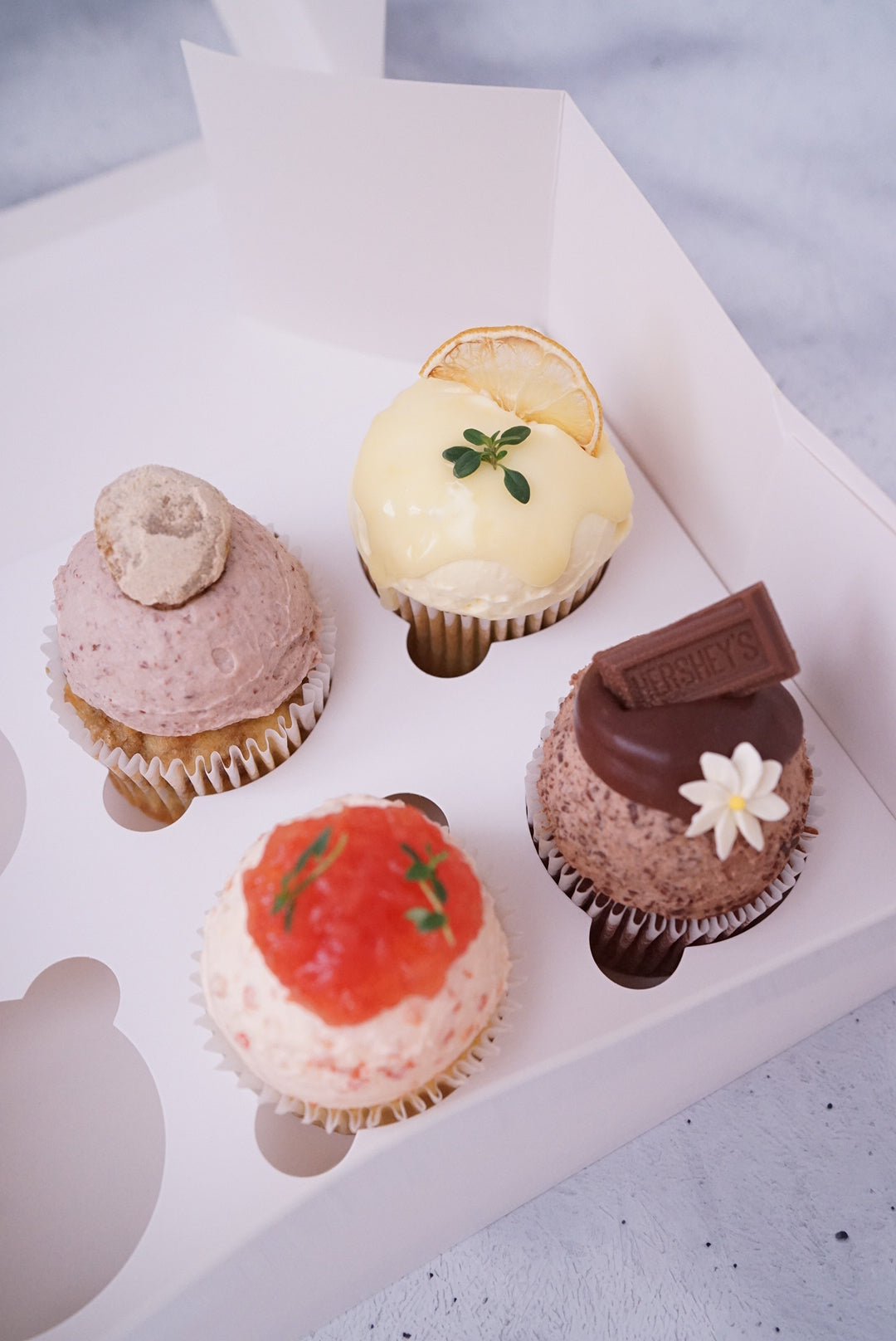 Assorted fresh cream cupcakes
